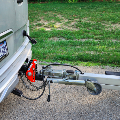 Shocker Impact Cushion Hitch Installed on Airstream Van Hooked Up to Trailer